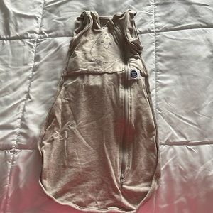 Nested bean sack, size NB (0-3 months), color is brown.